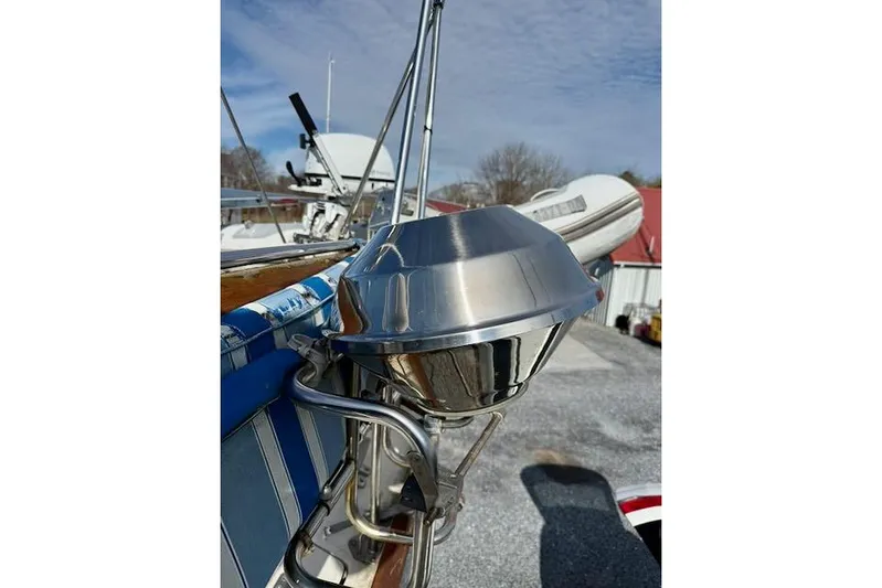 Mavi Yacht Photos Pics Stainless steel grill on 1991 Oyster 49 yacht deck under blue sky.