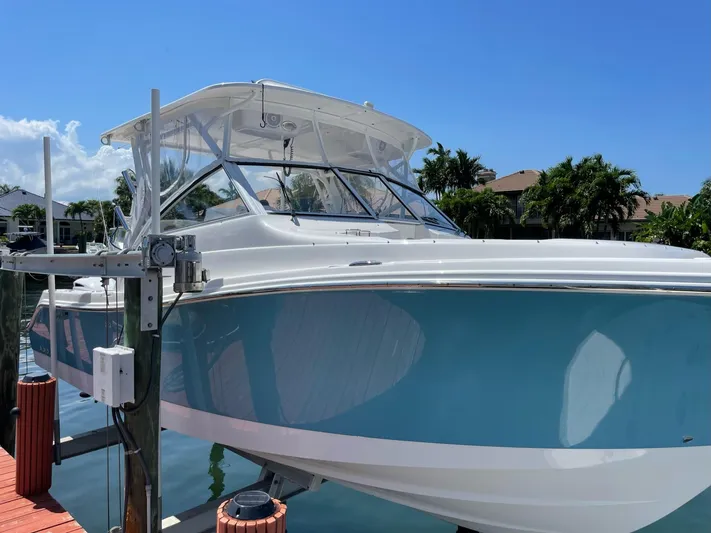  Yacht Photos Pics 2017 Edgewater 280 CX boat docked under clear blue sky.