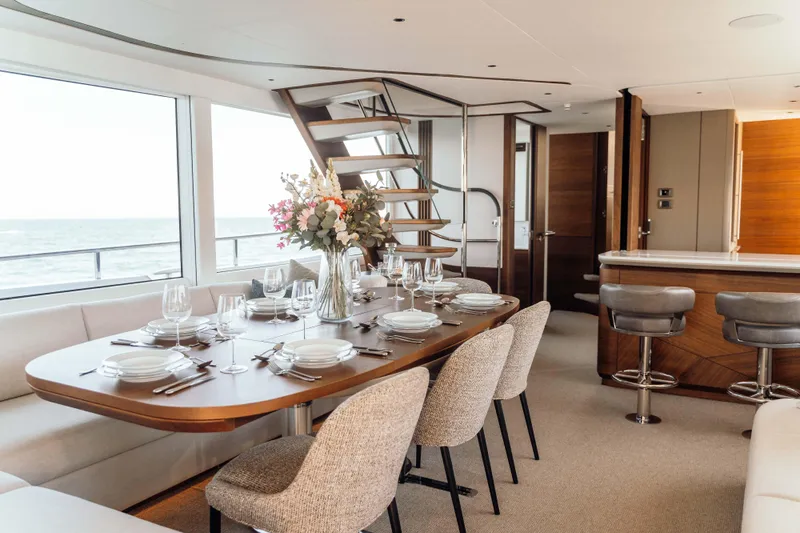 Chase Yacht Photos Pics Luxurious dining area on 2023 Princess X80 yacht with elegant table setting and ocean view.