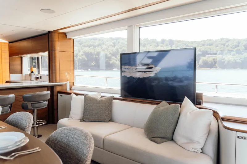 Chase Yacht Photos Pics Luxurious interior of 2023 Princess X80 yacht with modern decor and large windows.