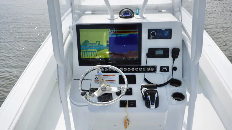  Yacht Photos Pics 2023 Contender 26 Bay boat console with navigation and control systems.
