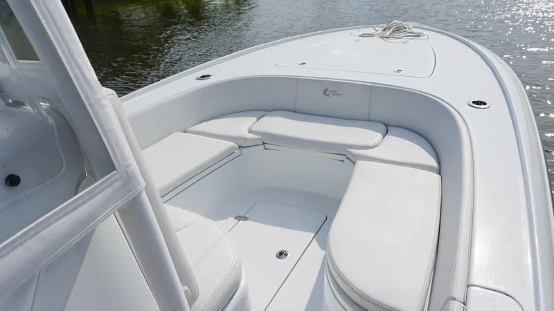  Yacht Photos Pics 2023 Contender 26 Bay boat with spacious seating on calm water.