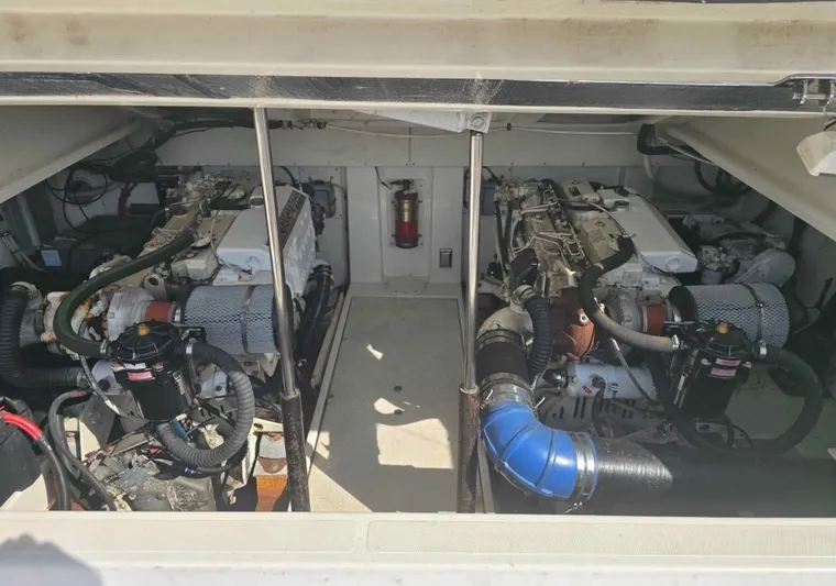 No Interruptions Yacht Photos Pics Engine compartment of a 2000 Rampage 38 Express boat, showcasing dual engines.