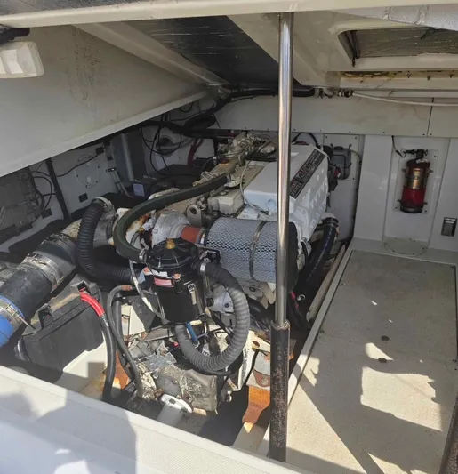 No Interruptions Yacht Photos Pics Engine room of a 2000 Rampage 38 Express boat, showcasing mechanical components.