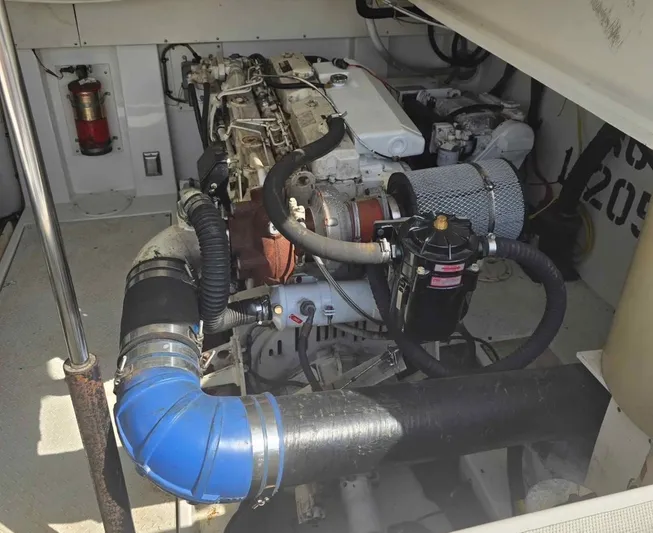 No Interruptions Yacht Photos Pics Engine compartment of a 2000 Rampage 38 Express boat, showcasing mechanical components and systems.