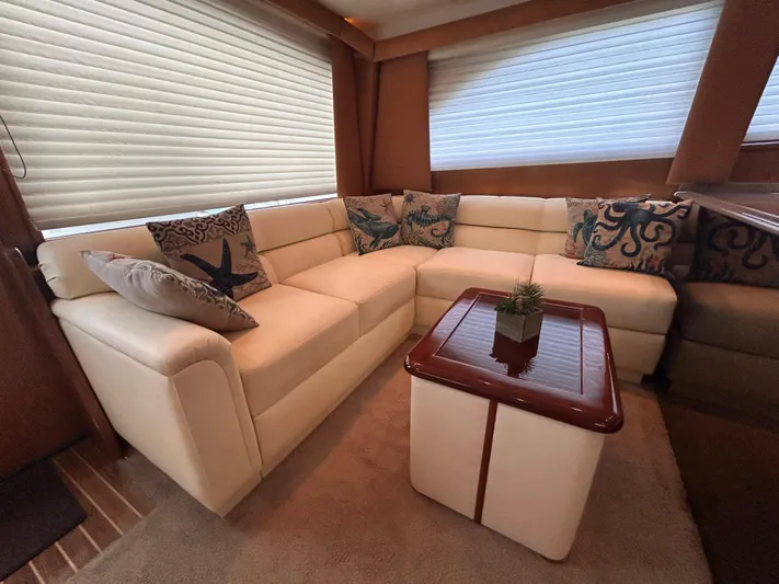  Yacht Photos Pics Luxurious interior of a 2004 Viking 48C yacht with plush seating and decorative pillows.