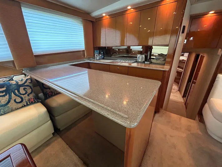  Yacht Photos Pics Luxurious 2004 Viking 48C yacht interior with modern kitchen and seating area.