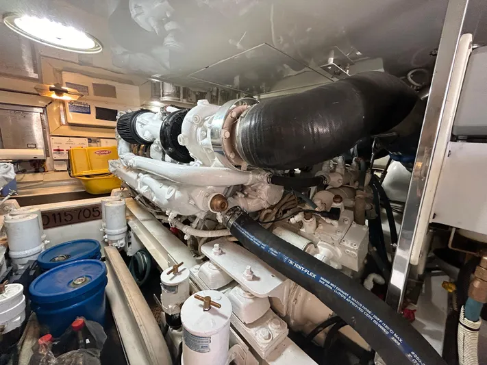  Yacht Photos Pics Engine room of a 2004 Viking 48C yacht, featuring complex machinery and storage barrels.