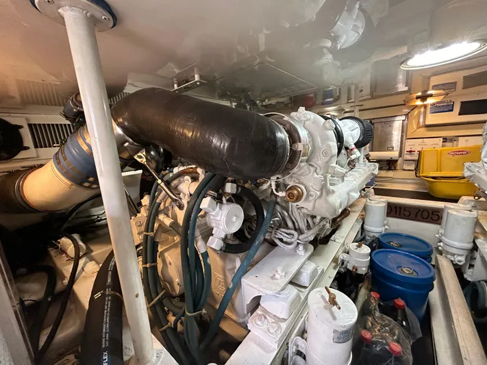  Yacht Photos Pics Engine room of a 2004 Viking 48C yacht, showcasing detailed mechanical components.