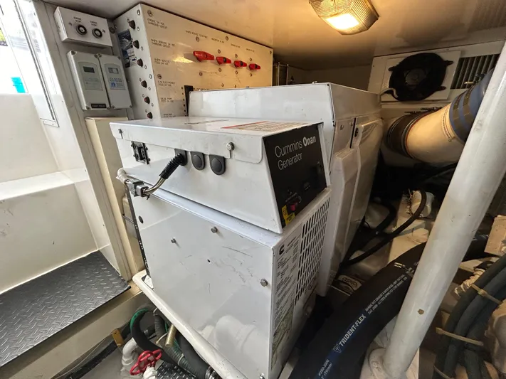  Yacht Photos Pics Engine room of 2004 Viking 48C yacht featuring Cummins Onan generator.