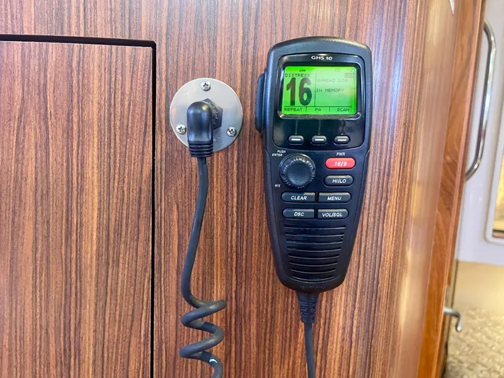 Hobi One Yacht Photos Pics VHF radio mounted on wood panel in 2015 Pursuit 345 Offshore boat.