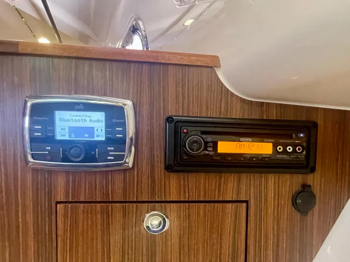 Hobi One Yacht Photos Pics Control panel of a 2015 Pursuit 345 Offshore boat with audio systems.