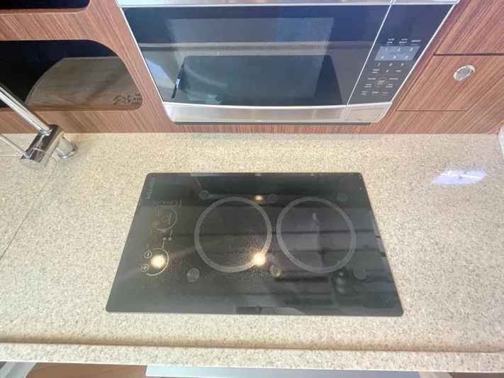 Hobi One Yacht Photos Pics Stovetop and microwave in 2015 Pursuit 345 Offshore boat kitchen.