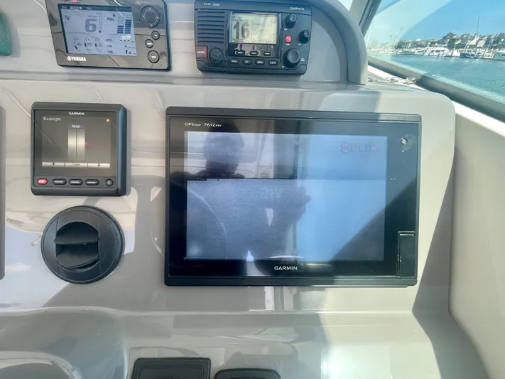 Hobi One Yacht Photos Pics Control panel of a 2015 Pursuit 345 Offshore boat with Garmin displays.