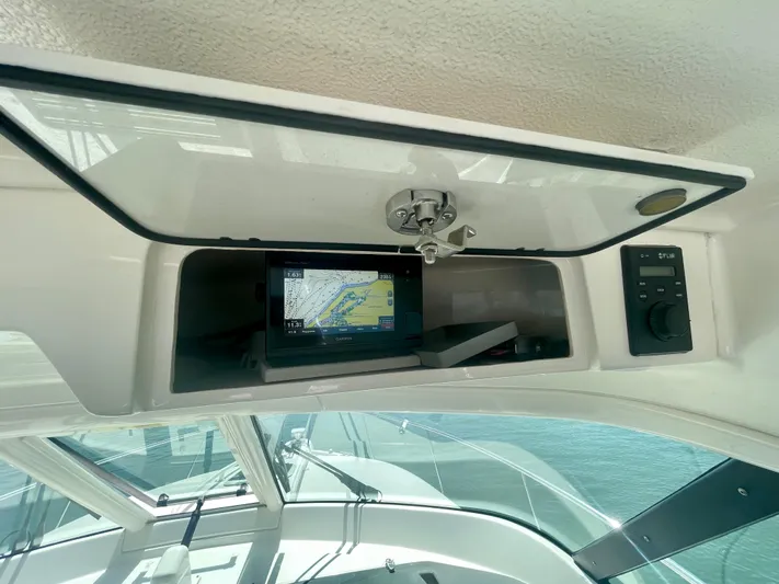 Hobi One Yacht Photos Pics 2015 Pursuit 345 Offshore boat dashboard with navigation system and controls.
