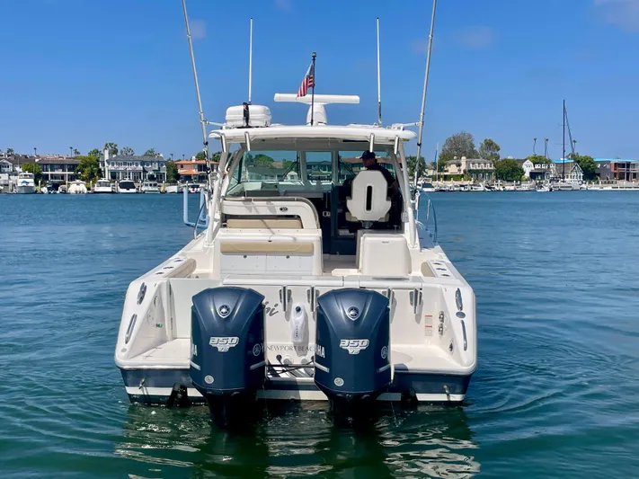 Hobi One Yacht Photos Pics 2015 Pursuit 345 Offshore boat with dual Yamaha engines on calm water.