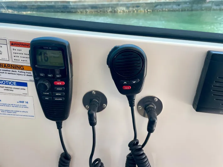 Hobi One Yacht Photos Pics VHF radio and microphone on 2015 Pursuit 345 Offshore boat dashboard.