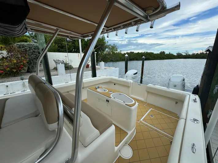  Yacht Photos Pics Mamba 350 boat interior, 2009 model, docked by a serene waterfront.