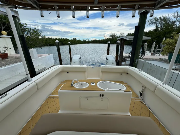  Yacht Photos Pics Mamba 350 boat interior, 2009 model, docked by a serene waterfront.