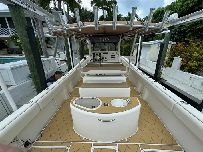  Yacht Photos Pics 2009 Mamba 350 boat interior with seating and fishing rod holders.