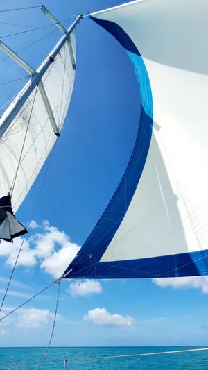 La Gaspesienne Yacht Photos Pics Sailing on a 2011 Beneteau Oceanis 40 with vibrant blue skies and sea.