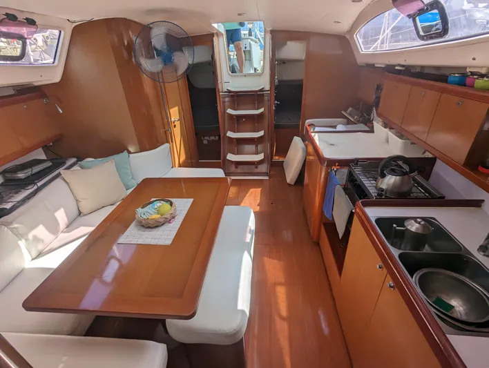 La Gaspesienne Yacht Photos Pics Interior of 2011 Beneteau Oceanis 40 sailboat with dining area and kitchen.