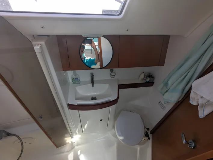 La Gaspesienne Yacht Photos Pics Interior of 2011 Beneteau Oceanis 40 yacht bathroom with sink, mirror, and toilet.