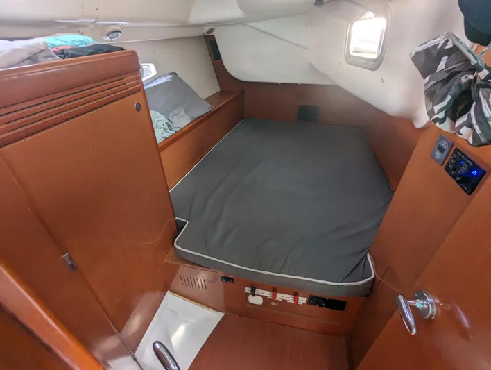 La Gaspesienne Yacht Photos Pics Cozy cabin interior of 2011 Beneteau Oceanis 40 sailboat with wooden finish and bed.