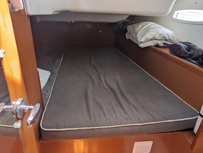 La Gaspesienne Yacht Photos Pics Cabin interior of 2011 Beneteau Oceanis 40 sailboat with bed and pillows.