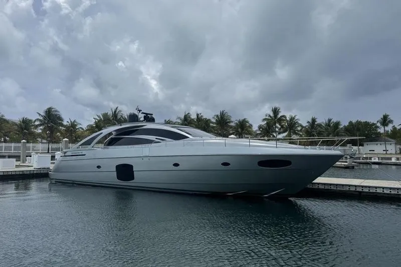  Yacht Photos Pics 2015 Pershing 70 yacht docked at marina under cloudy sky.