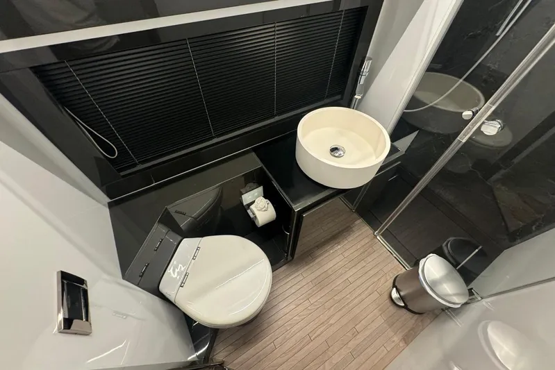  Yacht Photos Pics Luxurious bathroom in a 2015 Pershing 70 yacht, featuring modern fixtures and sleek design.