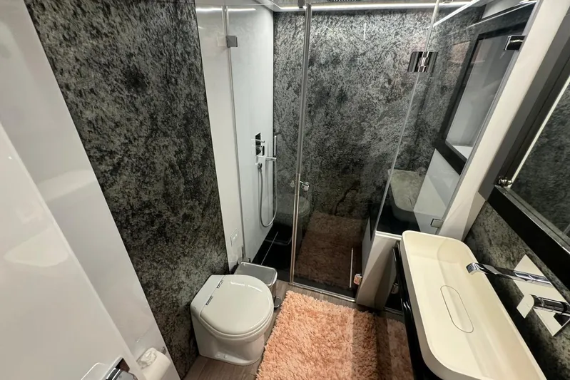  Yacht Photos Pics Luxurious bathroom in 2015 Pershing 70 yacht with modern fixtures and elegant design.