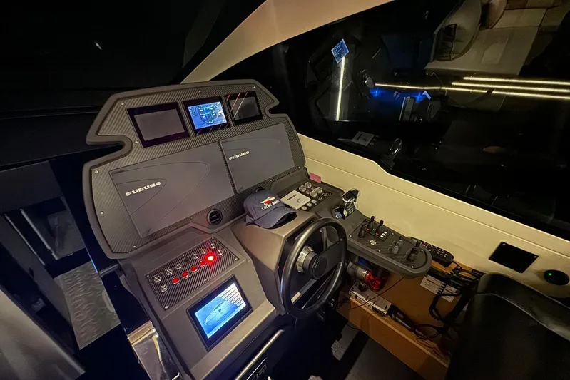  Yacht Photos Pics Cockpit of 2015 Pershing 70 yacht with advanced navigation systems and controls.