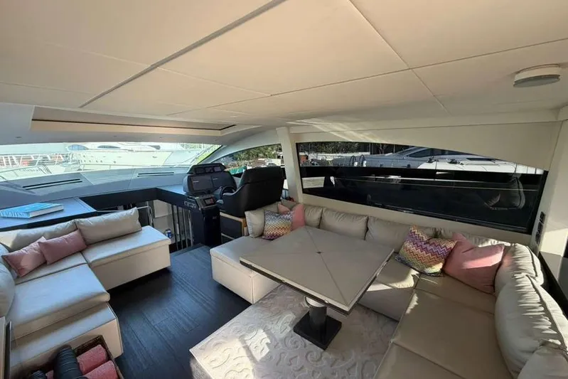  Yacht Photos Pics Luxurious interior of a 2015 Pershing 70 yacht with plush seating and modern design.