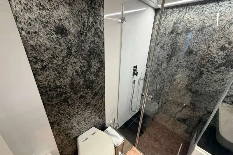  Yacht Photos Pics Luxurious bathroom in 2015 Pershing 70 yacht with modern shower and sleek design.