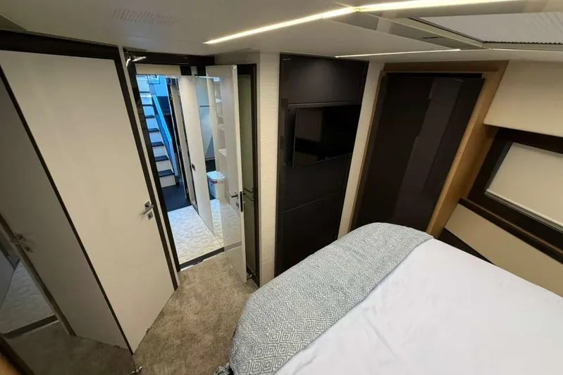  Yacht Photos Pics Luxurious interior of 2015 Pershing 70 yacht, featuring modern bedroom and sleek design.