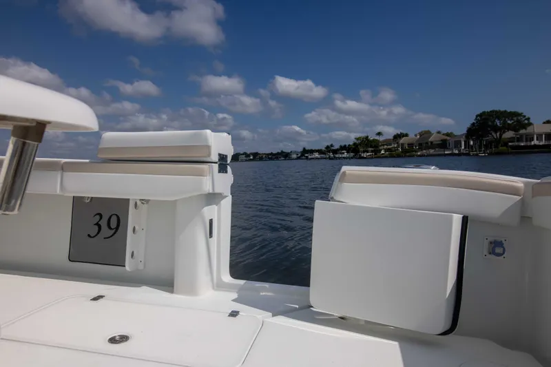 Kat Man Du Yacht Photos Pics 2017 Yellowfin 39 Center Console boat on a calm lake under a blue sky.