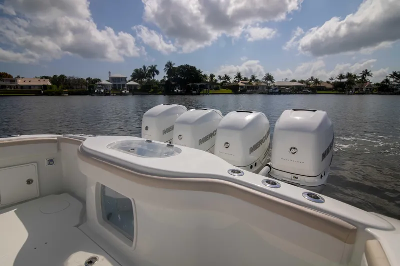 Kat Man Du Yacht Photos Pics 2017 Yellowfin 39 Center Console boat with four Mercury outboard engines on a calm lake.