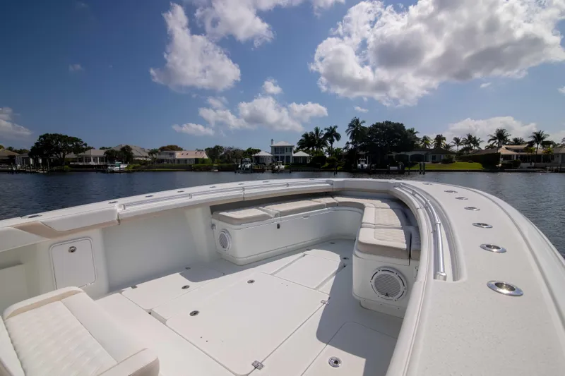 Kat Man Du Yacht Photos Pics 2017 Yellowfin 39 Center Console boat with spacious seating and scenic waterfront view.