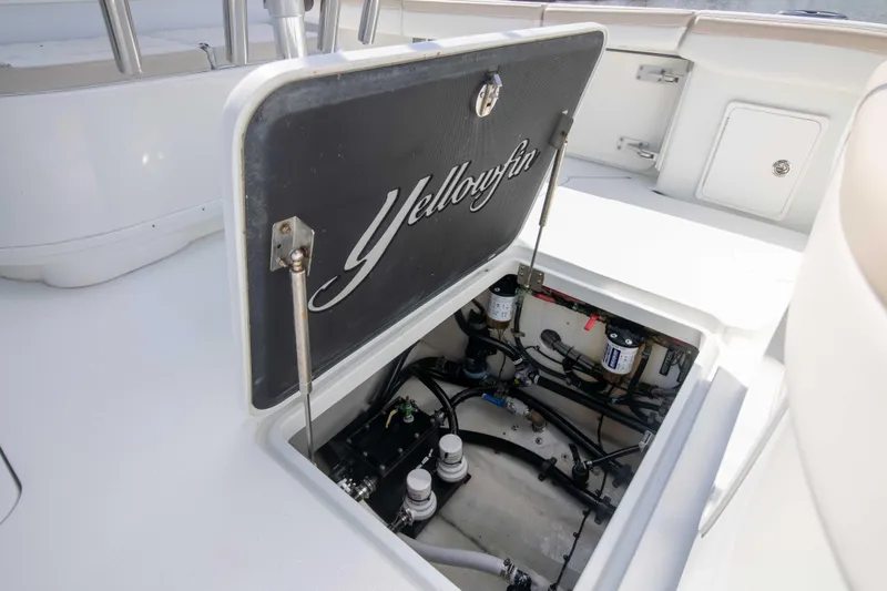 Kat Man Du Yacht Photos Pics 2017 Yellowfin 39 Center Console boat with open hatch showing internal components.