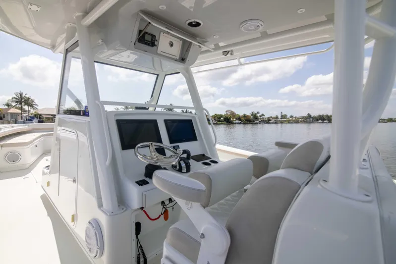 Kat Man Du Yacht Photos Pics 2017 Yellowfin 39 Center Console boat helm with dual screens and cushioned seating.