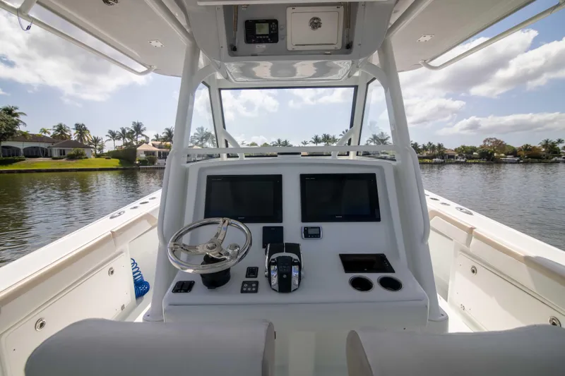 Kat Man Du Yacht Photos Pics 2017 Yellowfin 39 Center Console boat helm with dual screens and steering wheel.