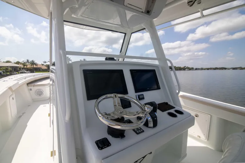 Kat Man Du Yacht Photos Pics 2017 Yellowfin 39 Center Console boat helm with dual screens and steering wheel.