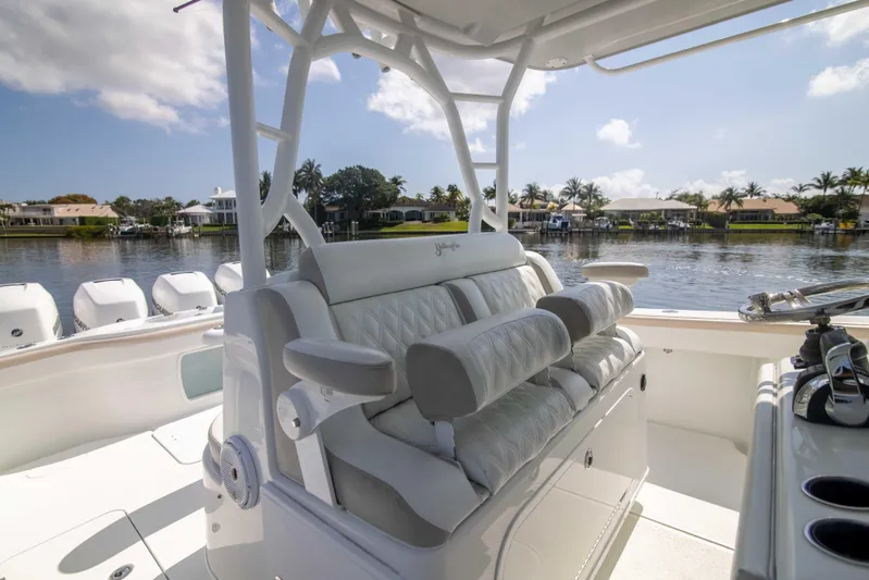 Kat Man Du Yacht Photos Pics 2017 Yellowfin 39 Center Console boat with luxurious seating and scenic waterfront view.