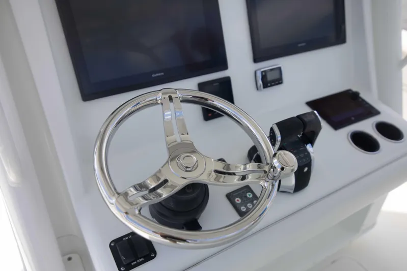 Kat Man Du Yacht Photos Pics 2017 Yellowfin 39 Center Console helm with dual screens and stainless steel steering wheel.