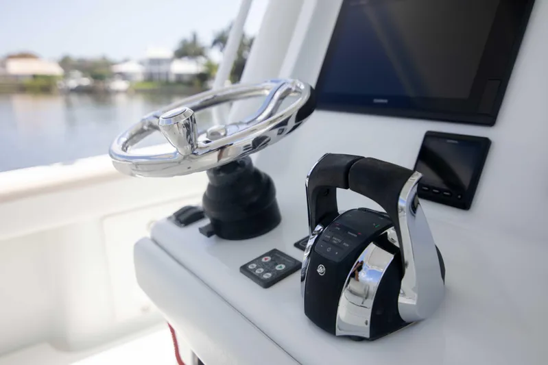 Kat Man Du Yacht Photos Pics 2017 Yellowfin 39 Center Console helm with steering wheel and controls.