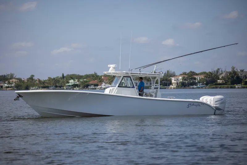 Kat Man Du Yacht Photos Pics 2017 Yellowfin 39 Center Console boat cruising on calm waters.