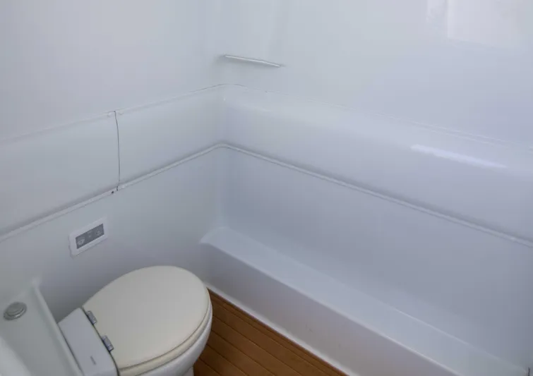 Kat Man Du Yacht Photos Pics 2017 Yellowfin 39 Center Console boat bathroom with white interior and wooden floor.