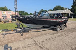 2023 Tracker Targa V-19 Combo Tournament Edition boat on trailer, parked outdoors.