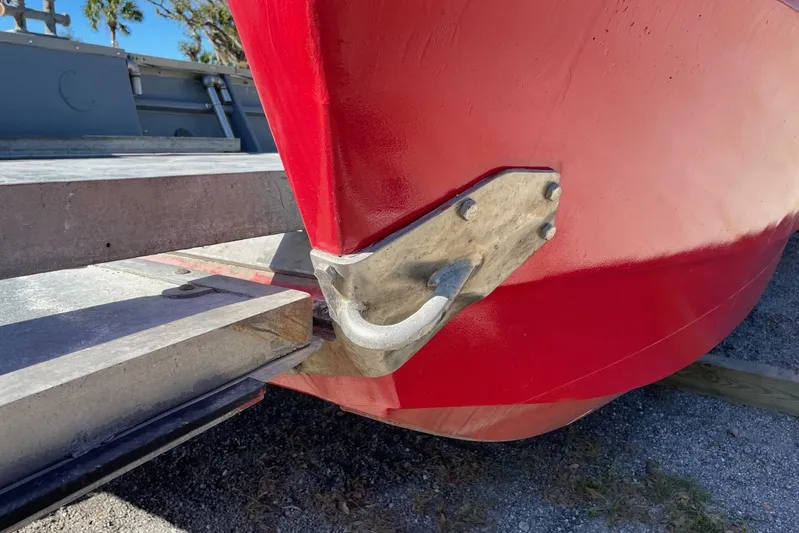 Asi Tender Yacht Photos Pics Red 1987 commercial buoy tender hull with metal fittings on a trailer.